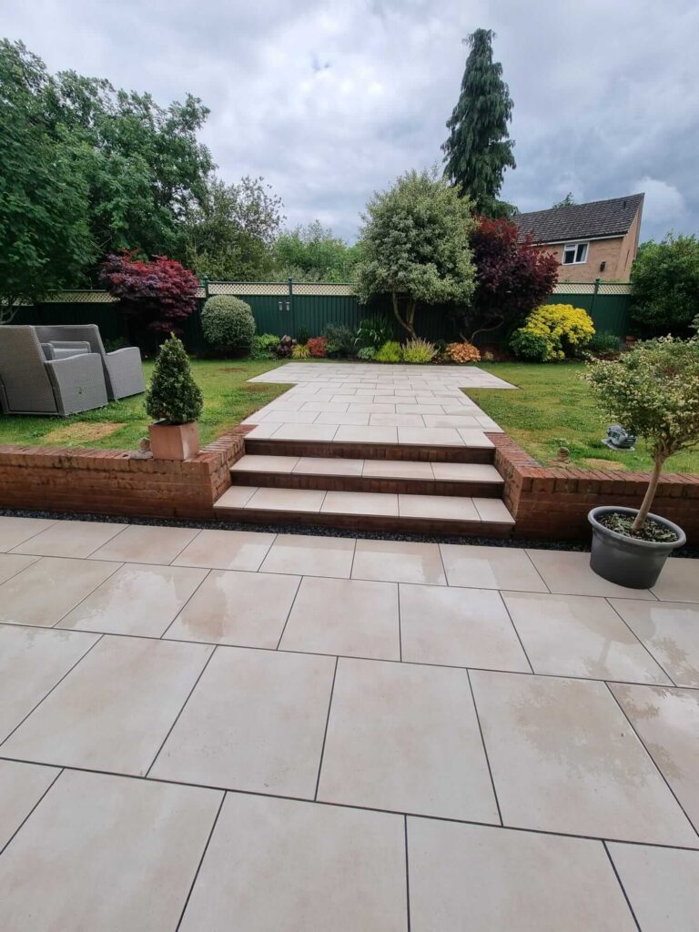 newly paved patio and retaining wall - A&C Landscapes Ltd landscaping services