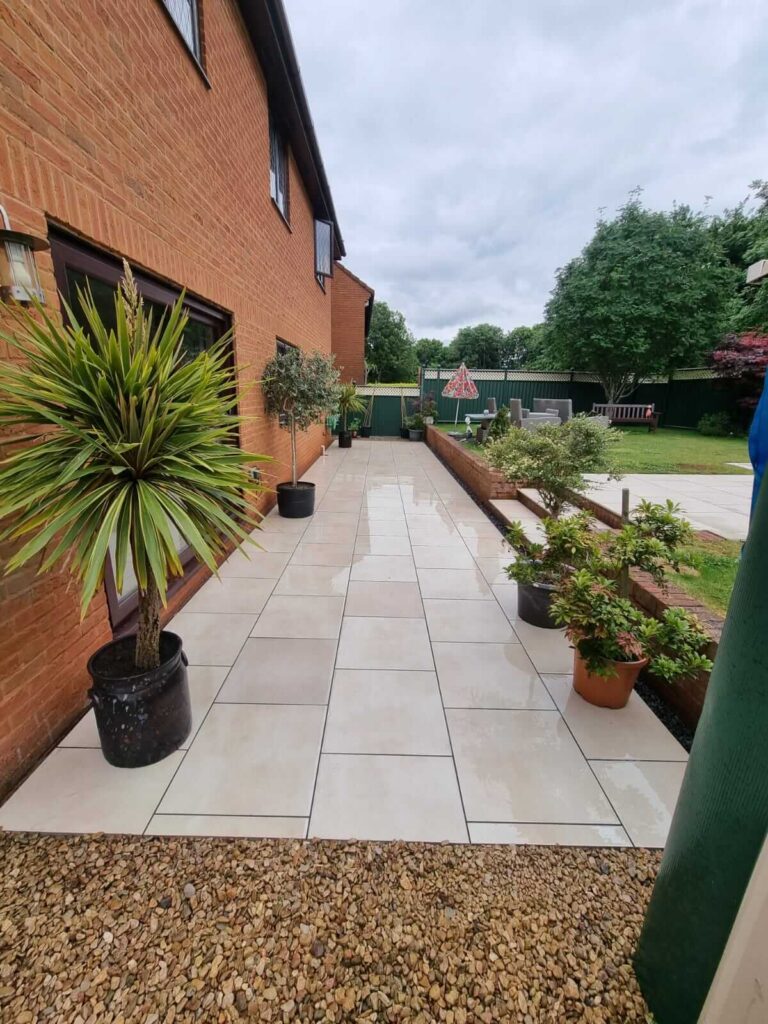 newly paved patio and retaining wall - A&C Landscapes Ltd landscaping services