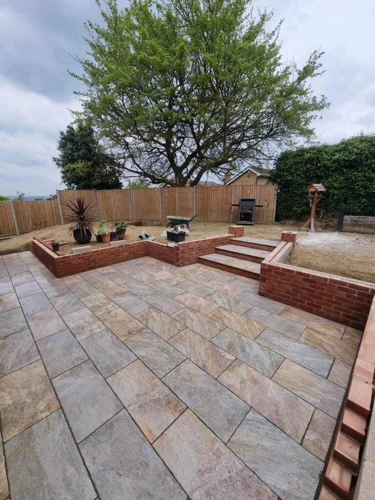 newly paved patio and retaining wall - A&C Landscapes Ltd landscaping services