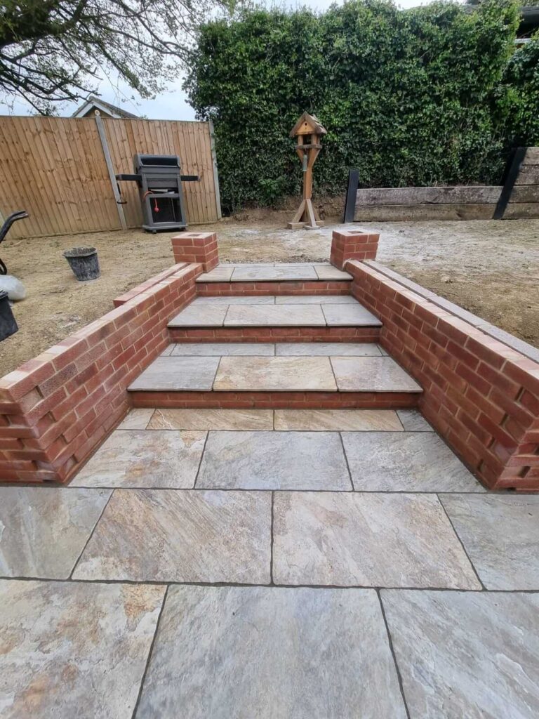 newly paved patio, steps and retaining wall - A&C Landscapes Ltd landscaping services