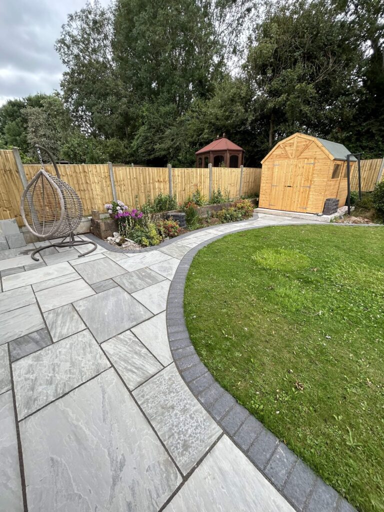 newly paved patio, flowerbed, fence and shed - A&C Landscapes Ltd landscaping services
