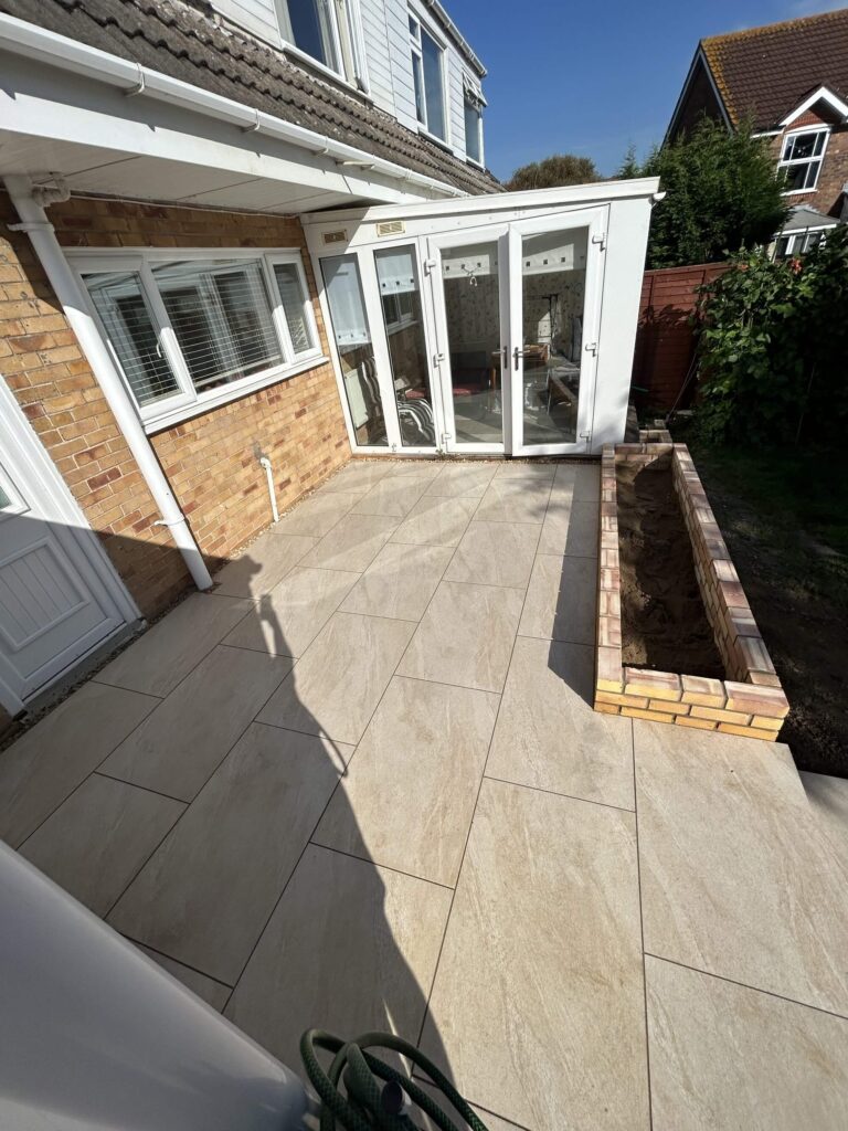 newly paved patio and retaining wall - A&C Landscapes Ltd landscaping services