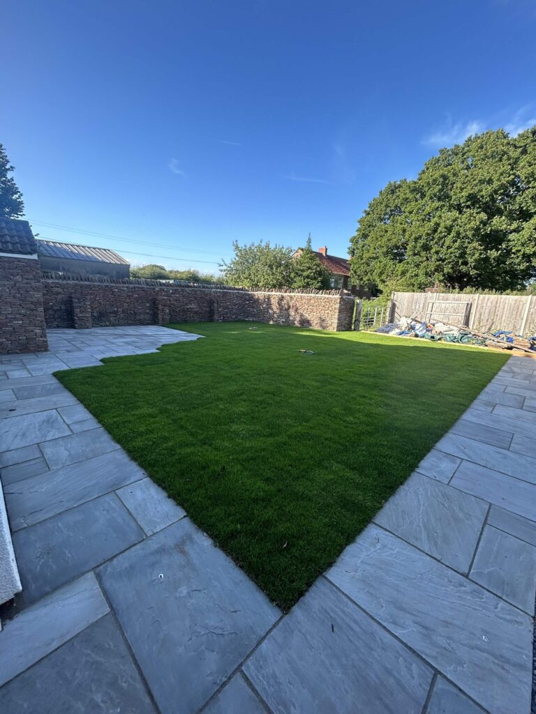 newly paved patio and laid grass - A&C Landscapes Ltd landscaping services